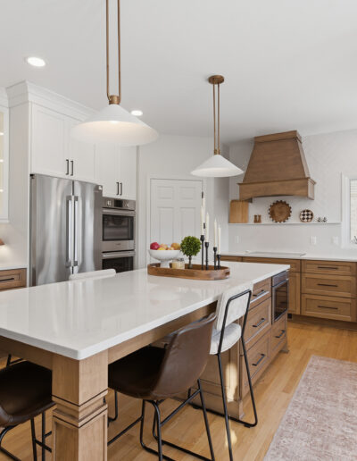Plymouth kitchen remodel with maple and painted cabinets, large island with seating